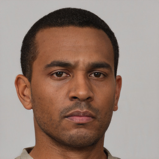 Neutral black young-adult male with short  black hair and brown eyes
