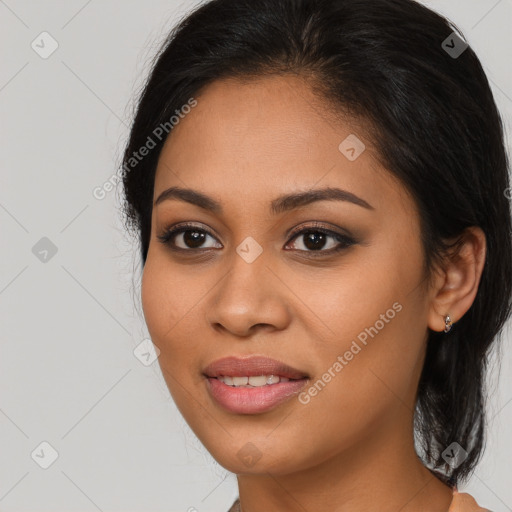 Joyful latino young-adult female with long  brown hair and brown eyes