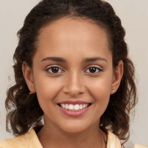 Joyful white child female with medium  brown hair and brown eyes