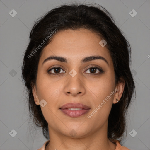 Joyful latino young-adult female with medium  brown hair and brown eyes