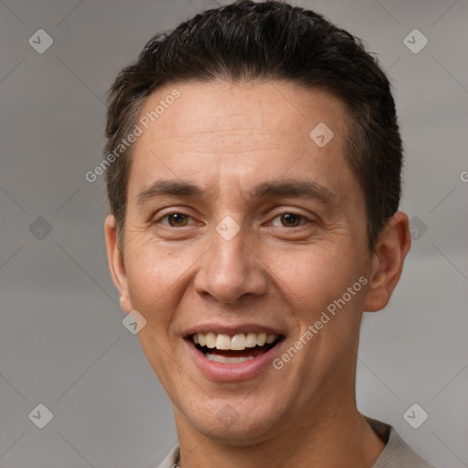 Joyful white adult male with short  brown hair and brown eyes