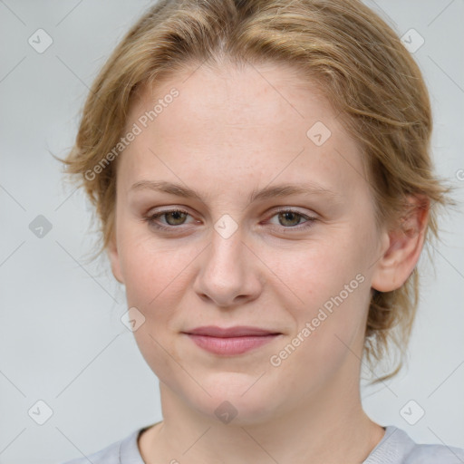 Joyful white young-adult female with medium  brown hair and blue eyes