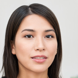 Joyful asian young-adult female with long  brown hair and brown eyes