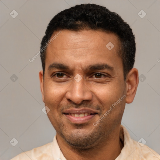 Joyful latino adult male with short  black hair and brown eyes