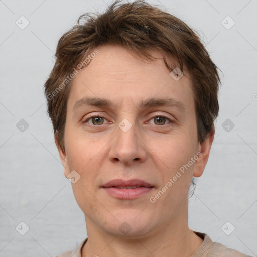 Joyful white adult male with short  brown hair and grey eyes