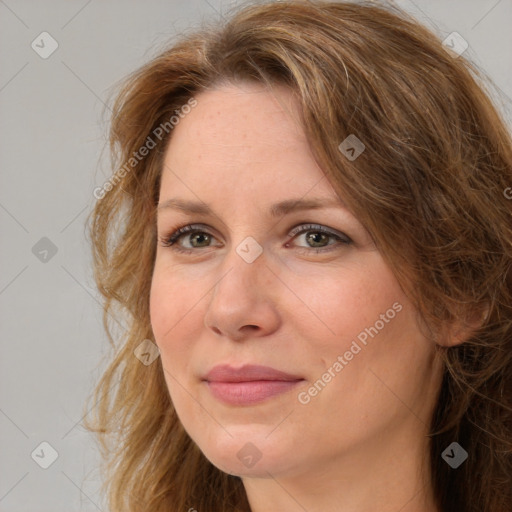 Joyful white adult female with long  brown hair and brown eyes