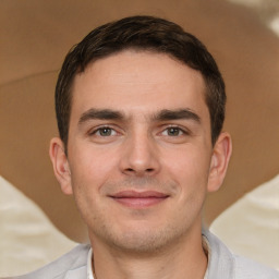 Joyful white young-adult male with short  brown hair and brown eyes