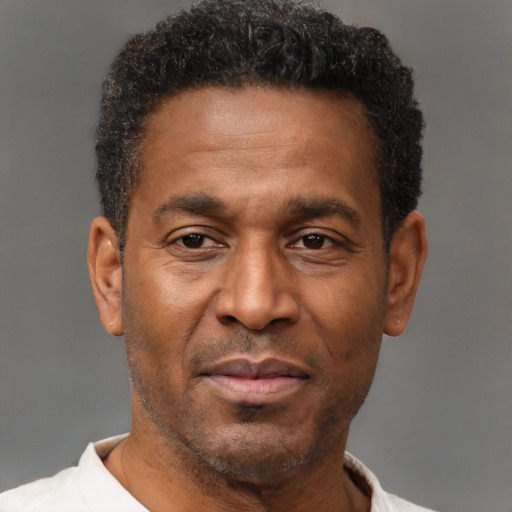 Neutral latino adult male with short  brown hair and brown eyes