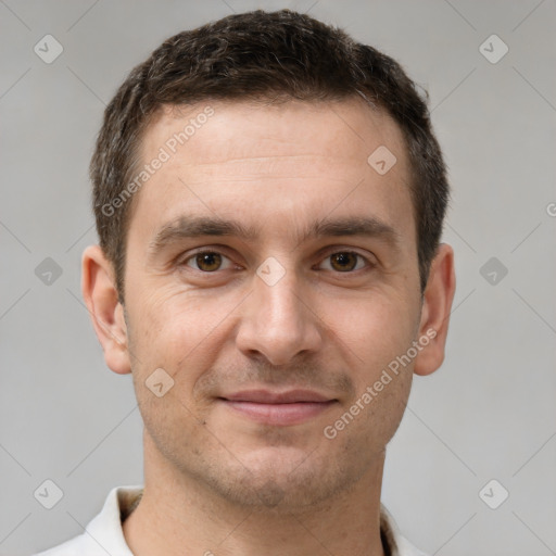 Joyful white young-adult male with short  brown hair and brown eyes