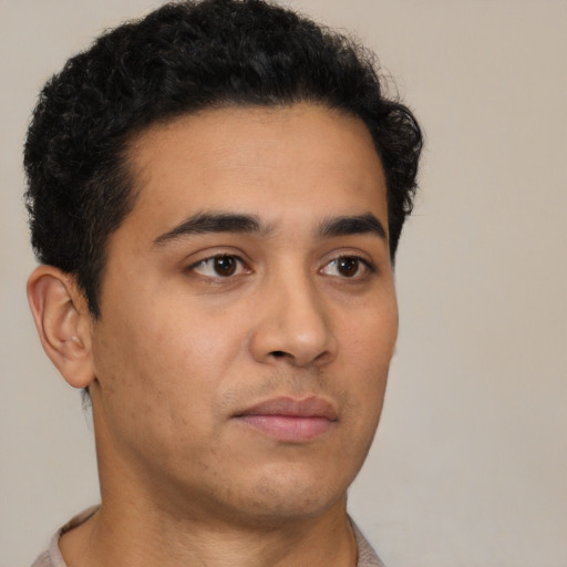 Neutral latino young-adult male with short  brown hair and brown eyes