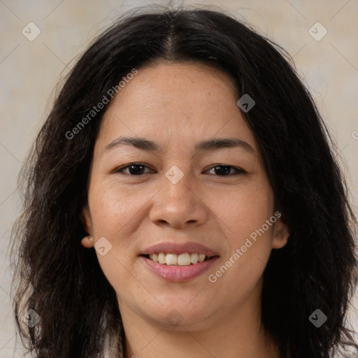 Joyful latino young-adult female with long  brown hair and brown eyes