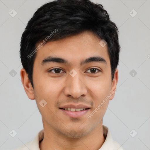 Joyful latino young-adult male with short  brown hair and brown eyes