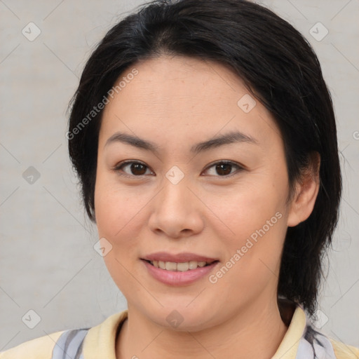 Joyful asian young-adult female with medium  brown hair and brown eyes