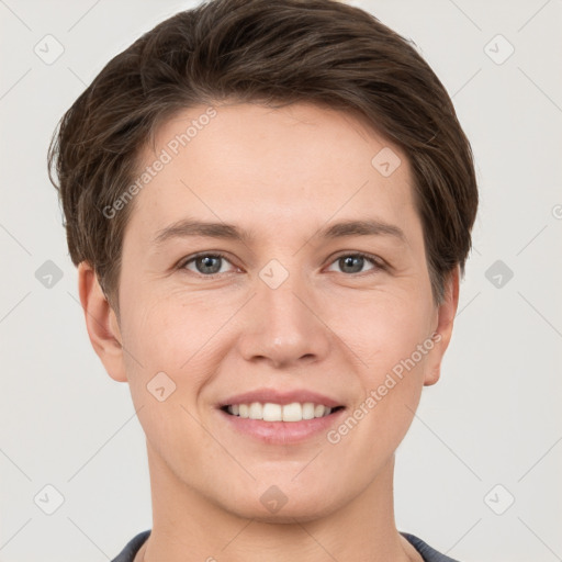 Joyful white young-adult female with short  brown hair and grey eyes