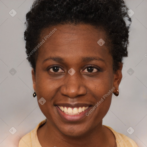 Joyful black young-adult female with short  brown hair and brown eyes