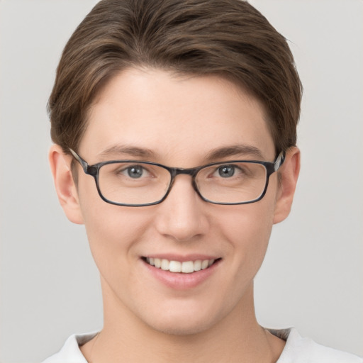 Joyful white young-adult female with short  brown hair and grey eyes