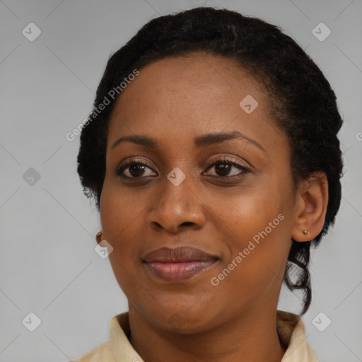 Joyful black adult female with short  black hair and brown eyes