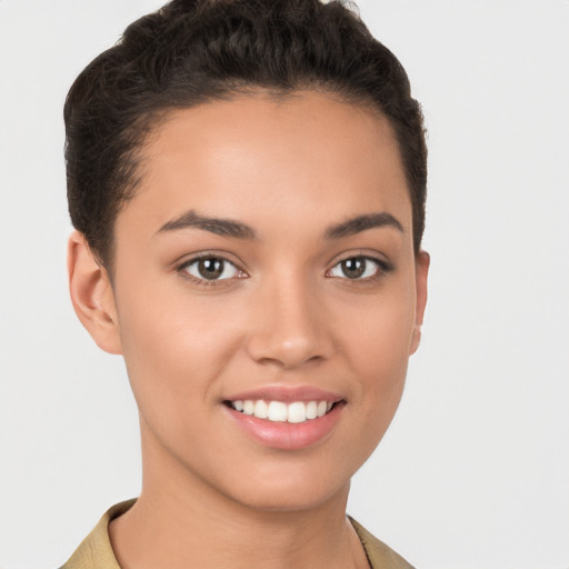 Joyful white young-adult female with short  brown hair and brown eyes