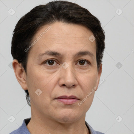 Joyful white adult female with short  brown hair and brown eyes