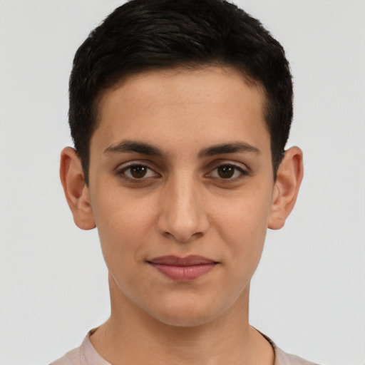 Joyful latino young-adult female with short  brown hair and brown eyes