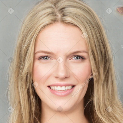 Joyful white young-adult female with long  brown hair and blue eyes