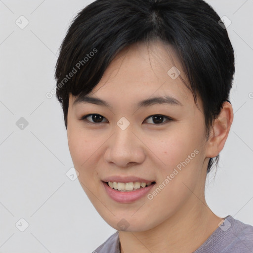 Joyful asian young-adult female with medium  black hair and brown eyes