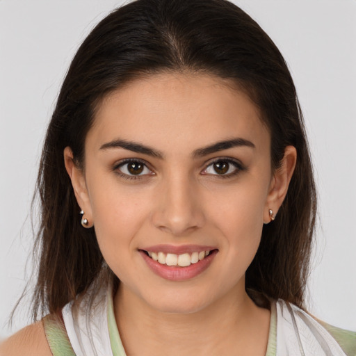 Joyful white young-adult female with medium  brown hair and brown eyes