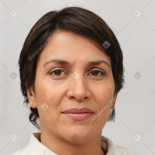 Joyful white adult female with short  brown hair and brown eyes