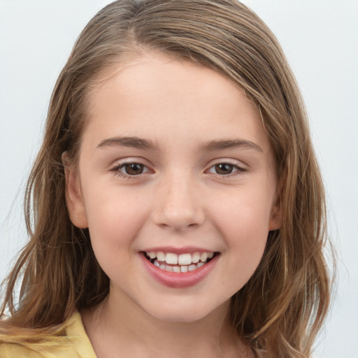 Joyful white child female with long  brown hair and brown eyes