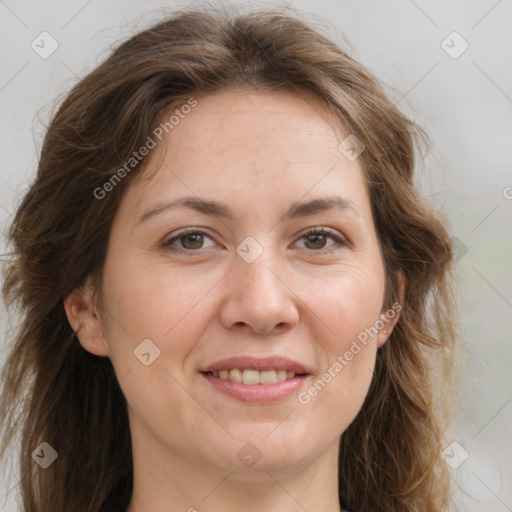 Joyful white adult female with long  brown hair and grey eyes