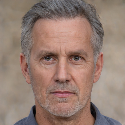 Neutral white middle-aged male with short  gray hair and brown eyes