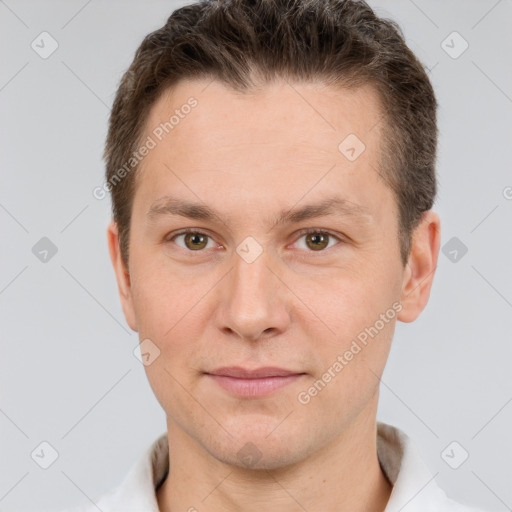 Joyful white adult male with short  brown hair and brown eyes