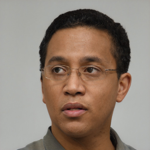 Neutral black adult male with short  black hair and brown eyes