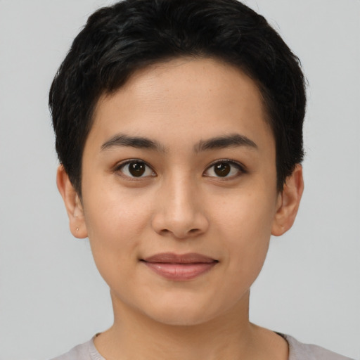Joyful asian young-adult female with short  black hair and brown eyes