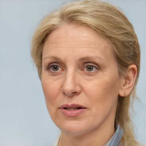 Joyful white middle-aged female with medium  brown hair and brown eyes