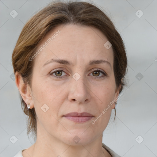 Joyful white adult female with medium  brown hair and grey eyes