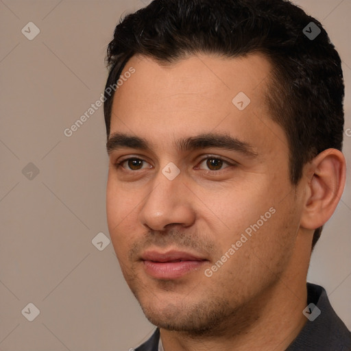 Joyful white young-adult male with short  black hair and brown eyes