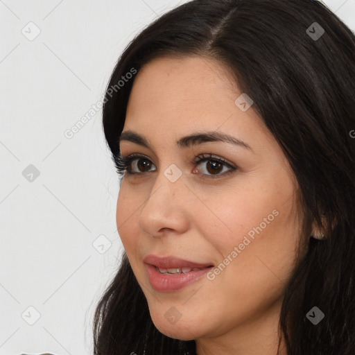 Joyful white young-adult female with long  black hair and brown eyes