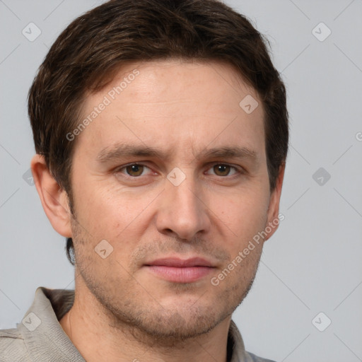 Joyful white adult male with short  brown hair and grey eyes