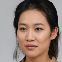 Joyful asian young-adult female with medium  brown hair and brown eyes