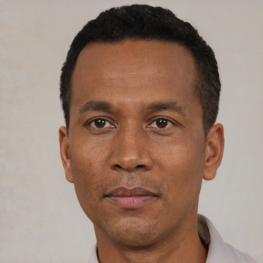 Neutral black adult male with short  black hair and brown eyes