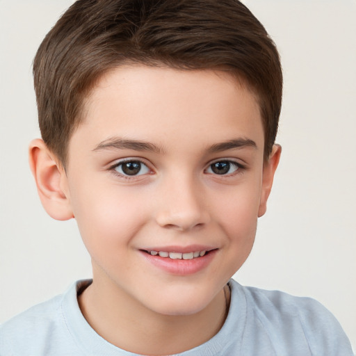 Joyful white child male with short  brown hair and brown eyes