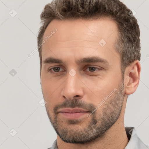 Neutral white young-adult male with short  brown hair and brown eyes