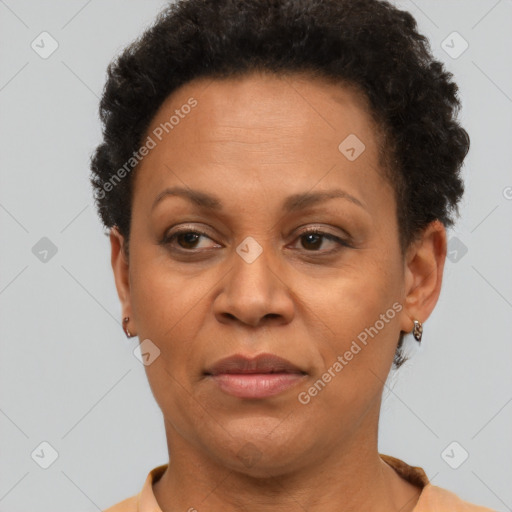 Joyful black adult female with short  brown hair and brown eyes