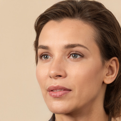 Joyful white young-adult female with medium  brown hair and brown eyes