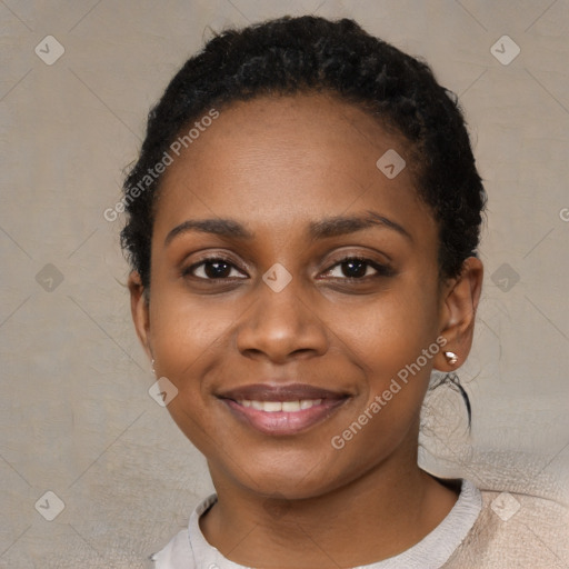 Joyful black young-adult female with short  black hair and brown eyes