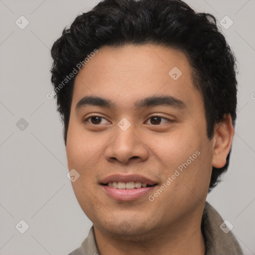 Joyful asian young-adult male with short  black hair and brown eyes