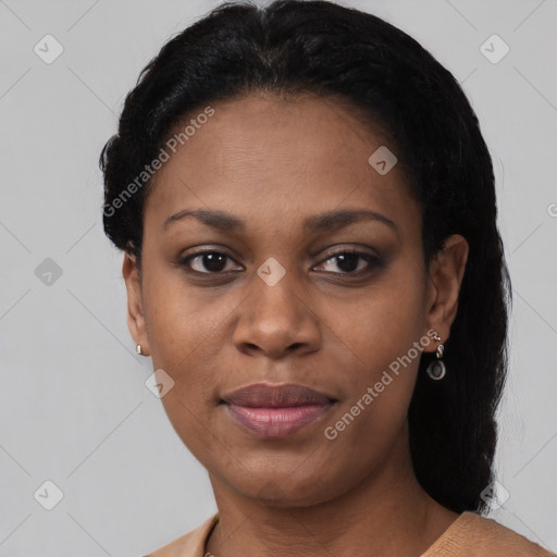 Joyful black young-adult female with short  black hair and brown eyes