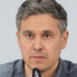 Neutral white middle-aged male with short  brown hair and brown eyes