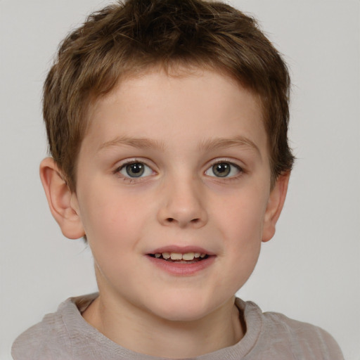 Joyful white child male with short  brown hair and brown eyes